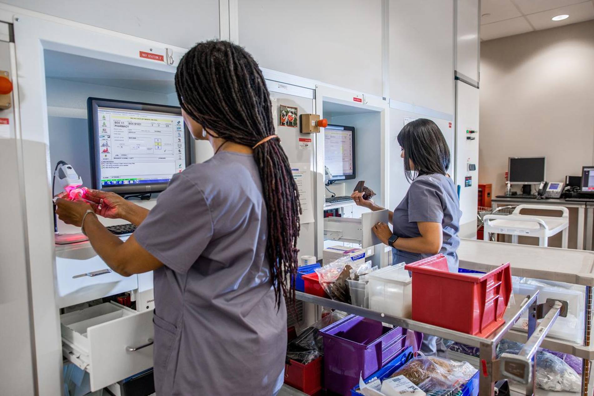 staff using Swisslog Healthcare BoxPicker