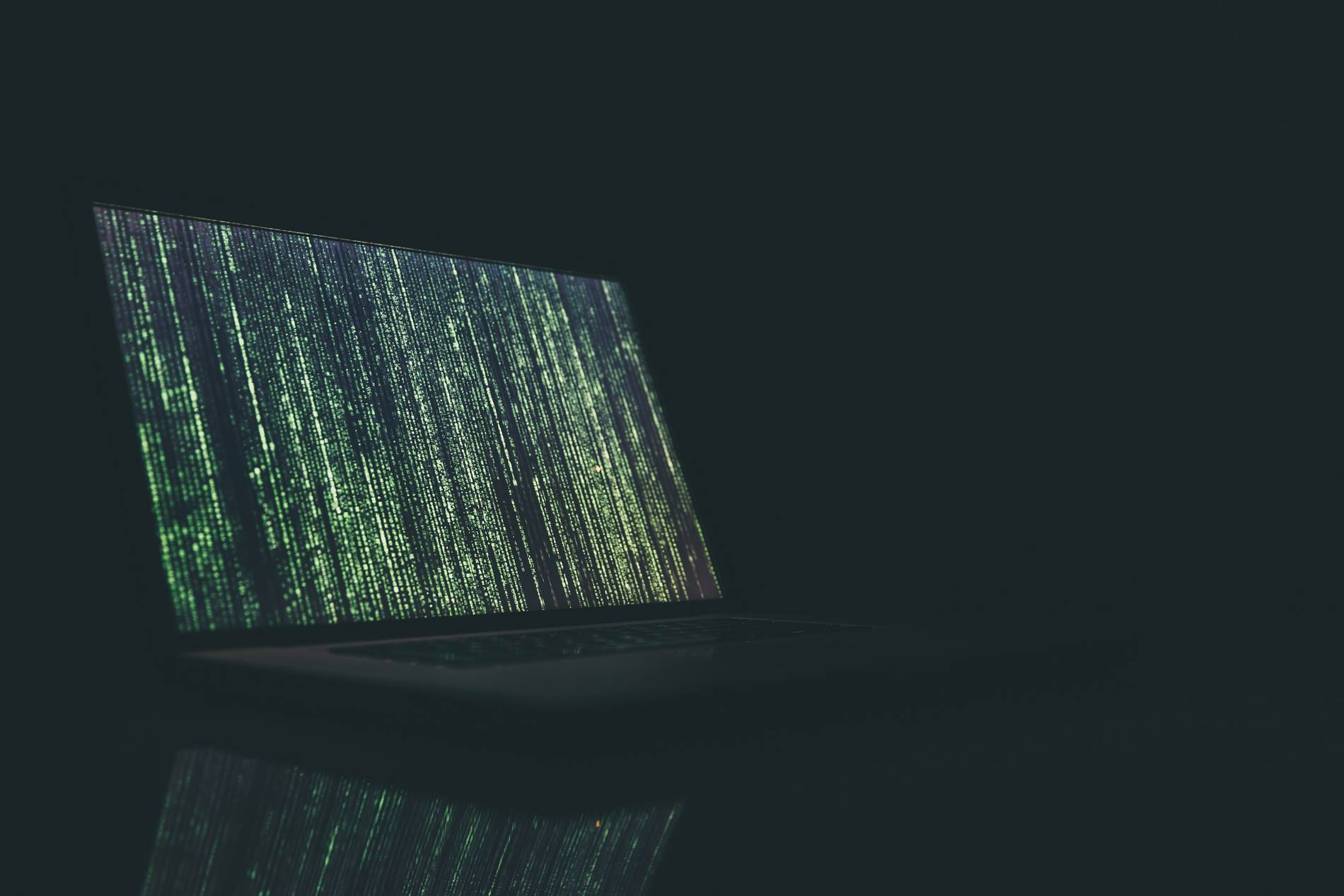 computer on desk running code