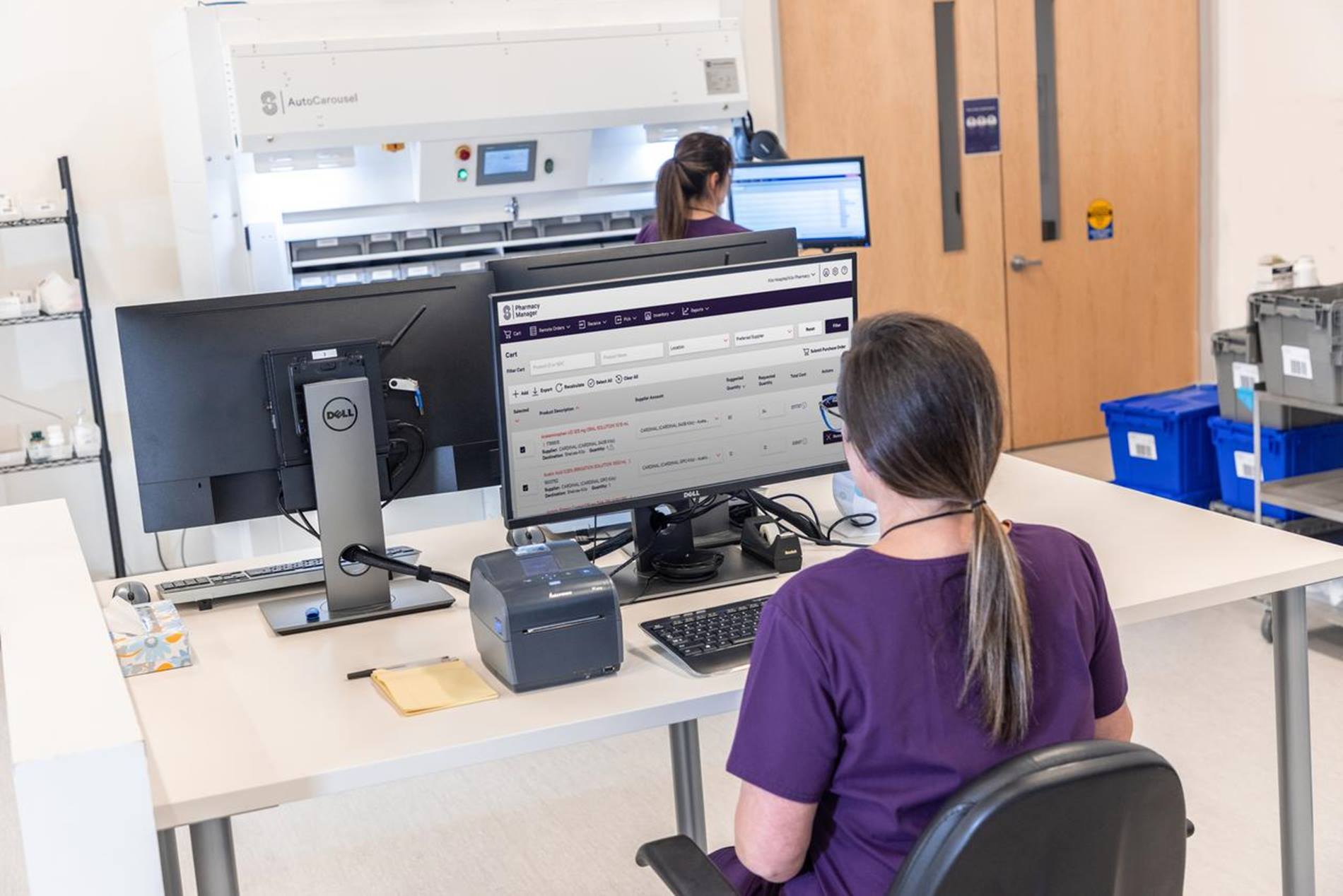 person using computer in pharmacy