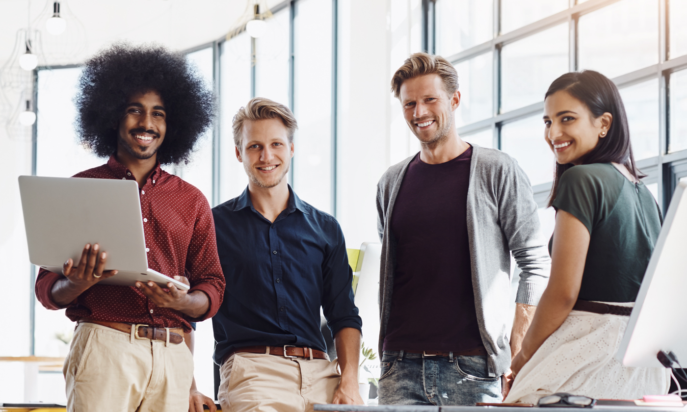 Team with man standing with laptop