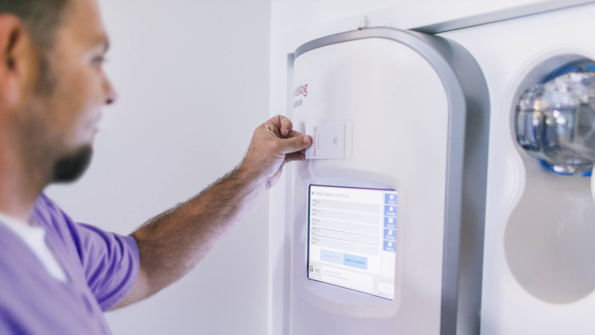 A technician operates a hospital pneumatic tube system station that has been modernized for peak system performance operation.