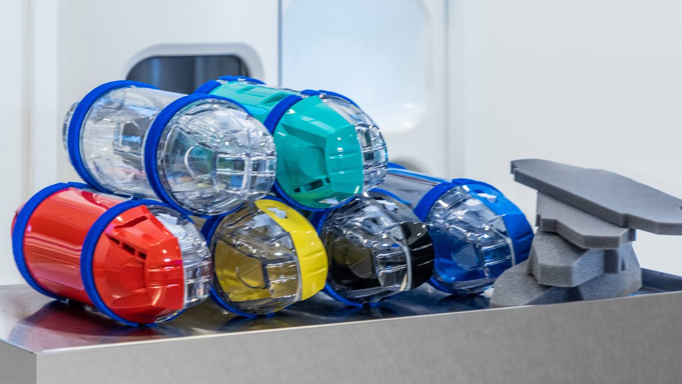 Pneumatic tube system carriers and storage units