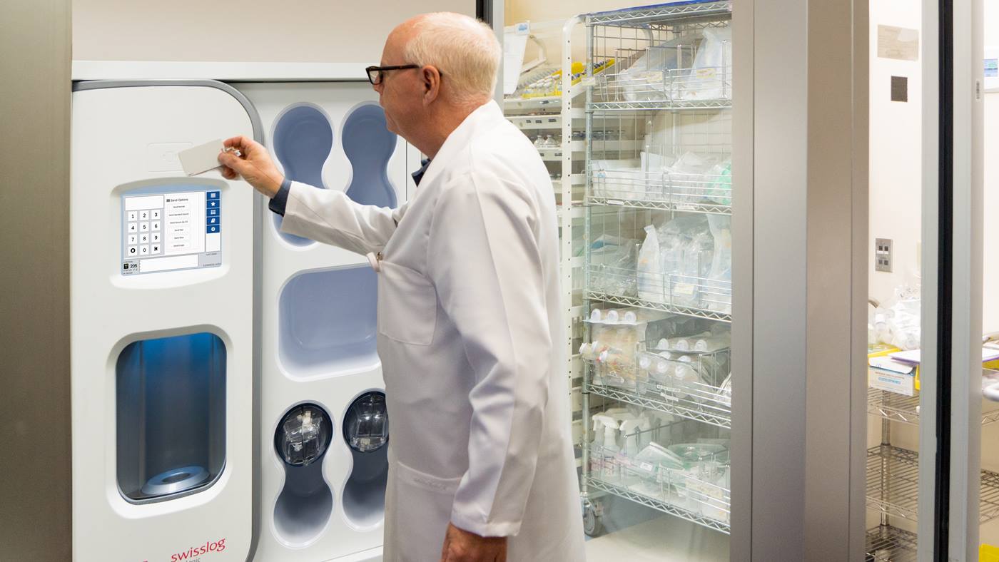 Healthcare professional securely operates a TransLogic Pneumatic Tube System station