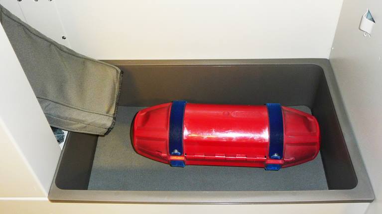 Pneumatic tube system carrier in the receiving bin of the TransLogic Whisper Receiving System