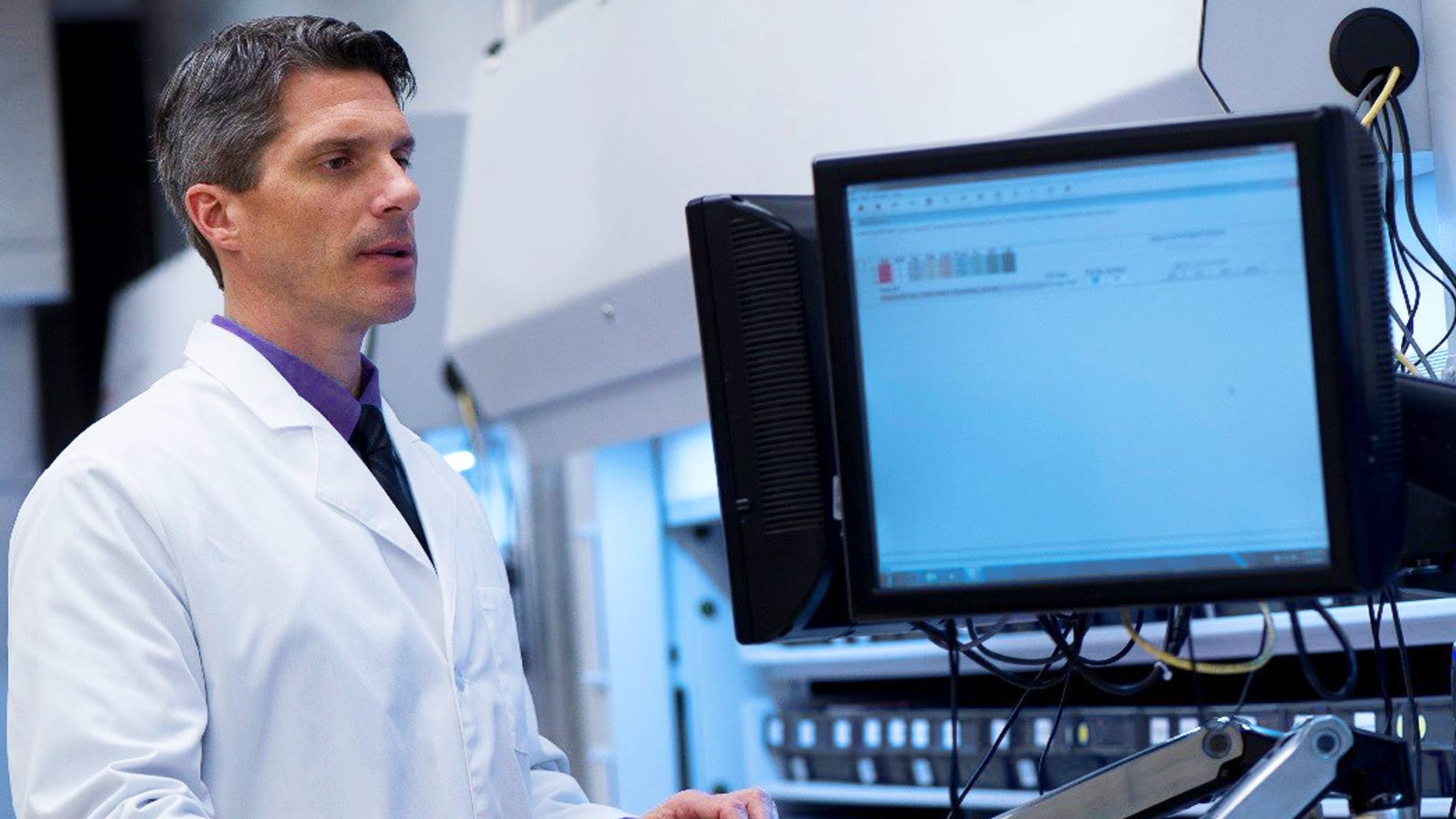 A pharmacist uses AutoPharm Enterprise, an enterprise-wide software that manages medication inventory.